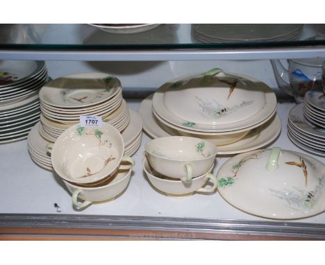 A Royal Doulton 'The Coppice' part dinner service: six dinner and side plates, four soup bowls and six saucers, two tureen an