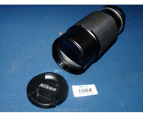 A Nikon Series E 70-210mm f/4 Ai-S manual focus Zoom Lens No. 1853568, with back cap and lens cap.