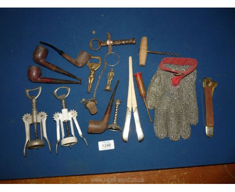 A tray of old pipes and bottle openers, cigar cutter, very small old oil dispenser, chain glove and silver handled glove stre