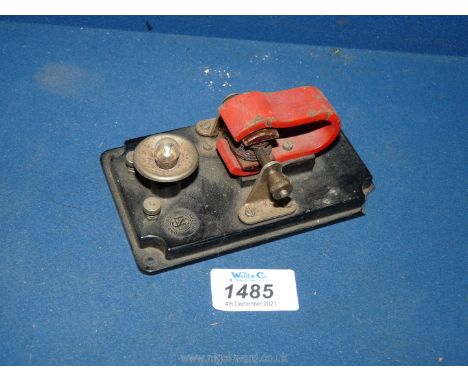 An ESL Bakelite based small toy generator illuminating a bulb, for driving by a small steam engine, 5'' long overall.