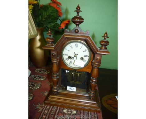 A Victorian Oak Mantel clock with white enamel face and Roman dial, complete with pendulum and key, approx. 40 cm x 23 cm 