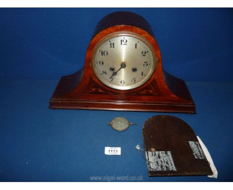 A Napoleon's hat shaped two train mantle Clock with marquetry detail, having Arabic numerals and pendulum (a/f). 17" wide x 1