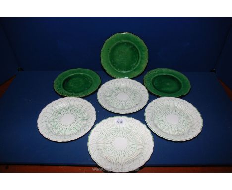 Four Wedgwood floral pattern plates and three green scalloped edged plates, (some chips and wear).