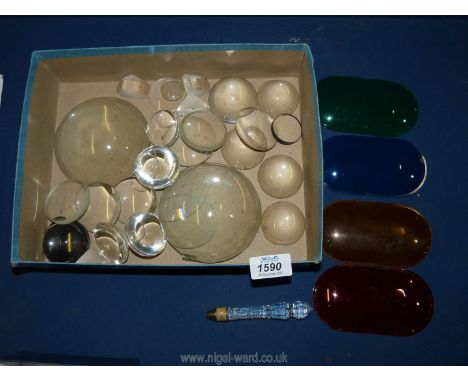 A quantity of domed glass lenses and four binocular prisms, four coloured light filters - red, amber, green and blue and a cu
