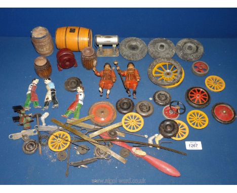 Miscellaneous rubber and metal wheels and tyres of various sizes, small wooden barrels, two vintage Beefeater Gin display fig