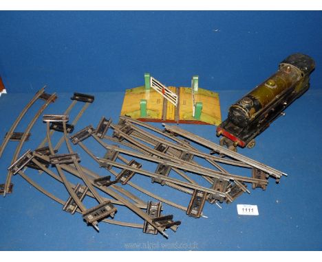 An O Gauge tinplate Train set with Bowman models 1930's steam operated 4-4-0 locomotive, level crossing and track, in vintage