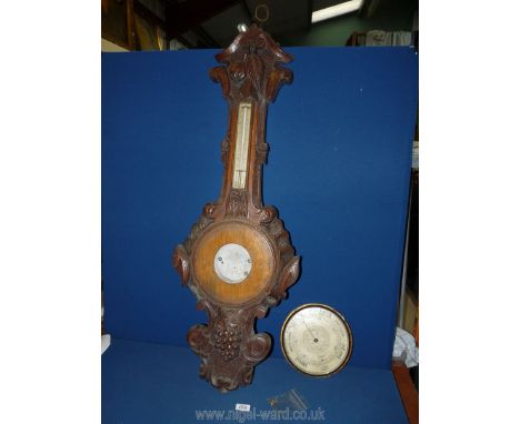A profusely carved Barometer, 41 3/4'' long, with dial, (but parts missing).