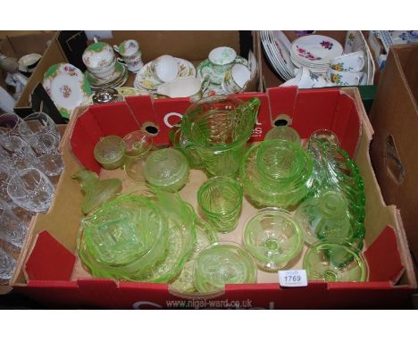 A quantity of various green glass including jug and two glasses, plates and dishes, some with lids, candlesticks etc., a/f.