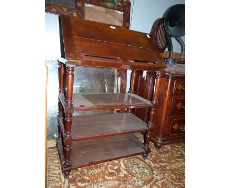 A most uncommon 19th c. metamorphic four tier Mahogany dumb waiter having turned supports, the top having a hinged leaf with 