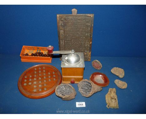 Five geological specimens, wooden Solitaire game, coffee grinder and a wooden Tibetan print plate.