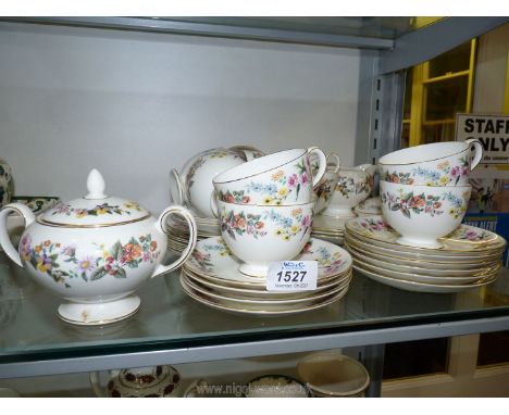 A Wedgwood 'Downland' part Teaset including nine cups, 12 saucers, cake and tea plates, milk jug, slop bowl, sucrier etc.