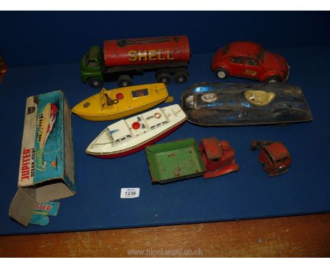 A quantity of toys including a Sutcliffe model boat (clockwork), a boxed ''Jupiter Ocean Pilot'' boat (Sutcliffe mode), a Tri