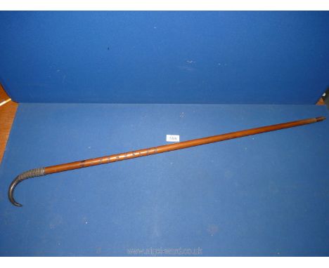 A Goat horn handled Swiss hiking stick with Swiss inscription down length of the cane.