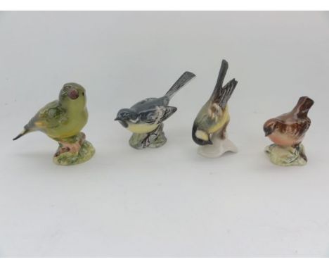 A collection of three Beswick models of birds comprising a Grey Wagtail 1041, a Wren 866 and a Greenfinch (?) with indistinct