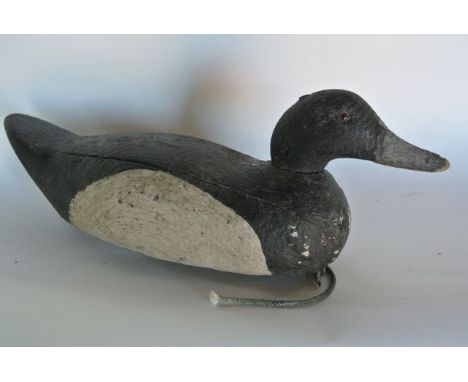 A vintage timber decoy duck with inset amber and black glass eyes, with all over painted finish, 40 cm long approx