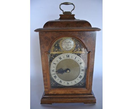 A reproduction Georgian style bracket clock in a burr walnut case with electronic movement