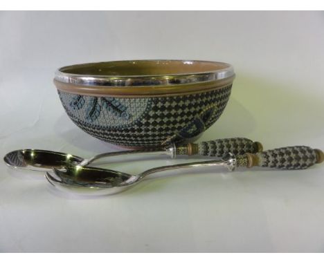 A Doulton Lambeth Silicon ware salad bowl with relief moulded stylised flower head decoration in tones of blue, cream and bro
