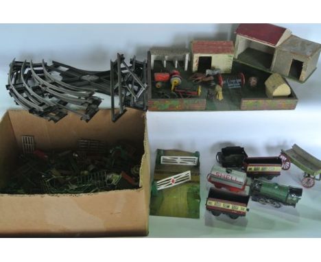 A quantity of vintage lead farmyard models and figures to include cows, sheep, farmyard machinery, buildings, fencing, horses