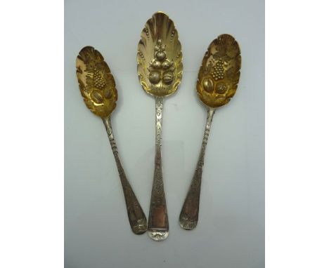 A George I silver berry spoon, indecipherable maker's mark, London, 1715, the gilt bowl chased with fruit, the handle decorat