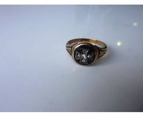 A Victorian black mourning/memorial ring, 1876, centred with a diamond-set Maltese cross motif, within a black enamelled grou
