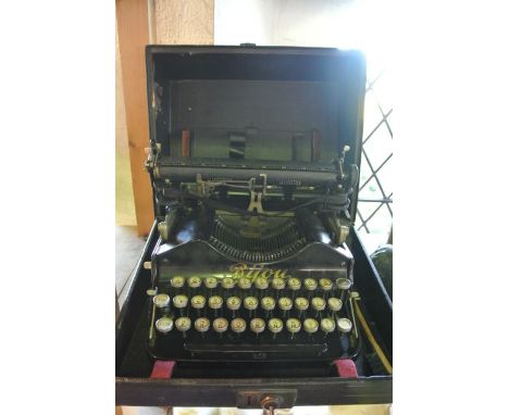 An unusual vintage typewriter in black colourway with folding roller and gilt lettering to front, Bijou, further mark to side