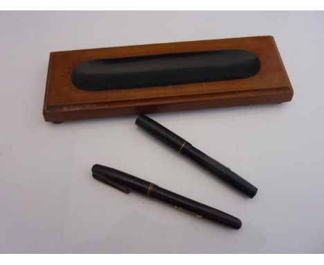 A vintage Waterman 512 and a Wyvern 606 fountain pen and a pen tray, proposing to have been made from timbers from The Royal 