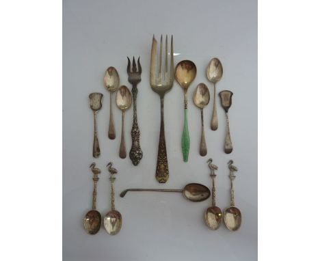 A Norwegian silver gilt and enamelled spoon, the bowl and handle with green enamelled decoration, 18g; a set of four silver s