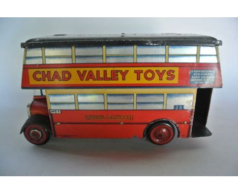A Chad Valley Toys clockwork tin plated double decker bus made for Carr's Biscuits with detachable roof set above banner with