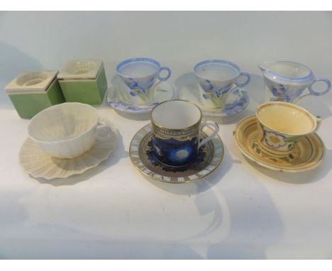 A pair of Shelley Blue Iris pattern coffee cups and saucers together with a matching cream jug, a pair of Clarice Cliff Bizar