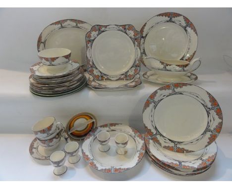 A collection of Crown Ducal Orange Tree pattern wares comprising a sauce boat and stand, an oval meat plate, three square sha