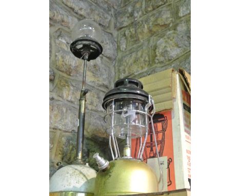 A vintage Tilley lamp on telescopic stem with small Pyrex clear bulbous chimney together with a further boxed Tilley storm li