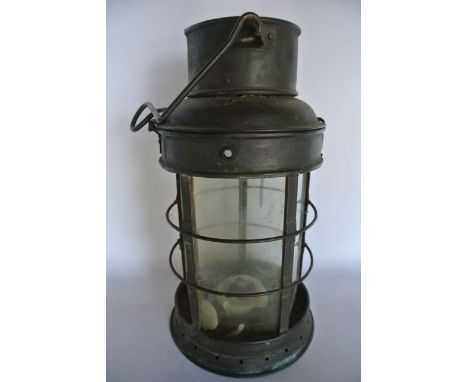 A late 19th/early 20th century brass hanging lantern of pentagonal form, with clear glass panelled sides set within a cylindr