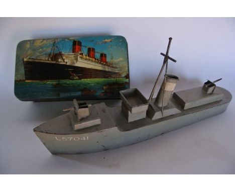 A vintage tin work model of a battle ship with all over grey painted finish bearing identification L57041, 31 cm long approx 