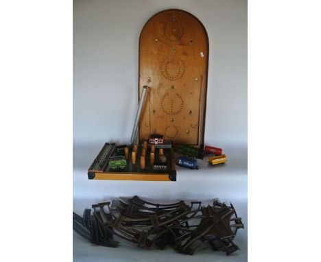 A vintage timber Bagatelle board together with a further vintage bar skittles arrangement, an 0 gauge clockwork engine number
