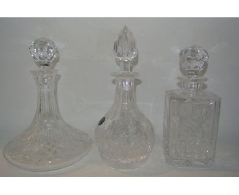 A trio of clear cut decanters to include an ovoid example etched and stickered Stuart, an Edinburgh Crystal square decanter a