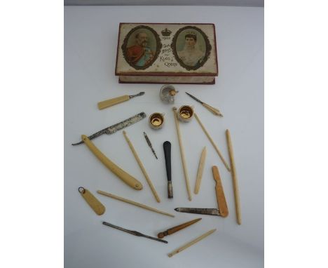 A 1902 Coronation souvenir box containing a silver mounted cigarette holder, bonework needlework tools, etc