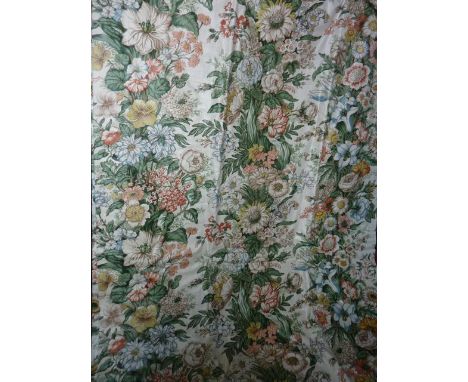 A quantity of vintage curtains with printed floral decoration upon a cream coloured ground