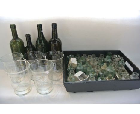 Four vintage wine bottles, two in green glass, two in brown together with four large glass beakers with flared rims and etche