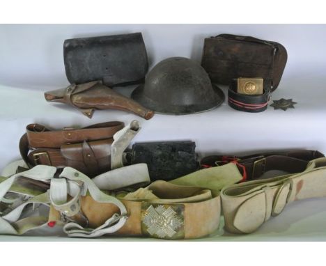 An interesting selection of vintage militaria to include two early 20th century stitched leather ammunition cases, a Highland