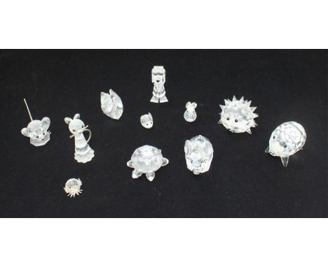 Eleven assorted miniature Swarovski animals, including a swan, a hedgehog and an elephant etc.