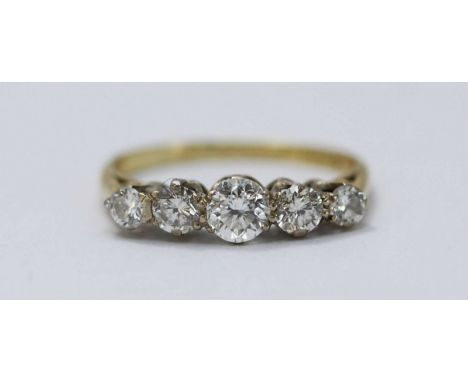 An 18ct yellow gold five-stone diamond ring, claw-set graduated RBC diamonds, estimated total diamond weight 1.20 cts, 2.90g,