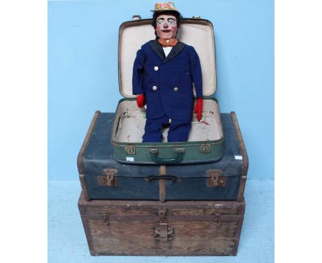 A collection of 1950s professional magician's props including a ventriloquist's doll, in two cases and wooden trunk