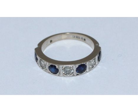 An 18ct gold, diamond and sapphire half-eternity ring, set with four round faceted sapphires and three rbc diamonds, estimate