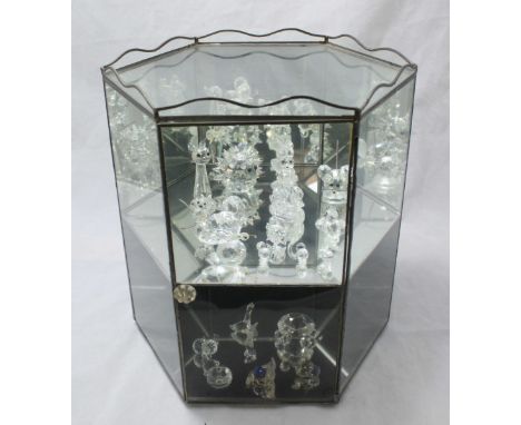 A collection of twelve Swarovski glass animals including a swan, a hedgehog and a mouse, together with four various non Swaro