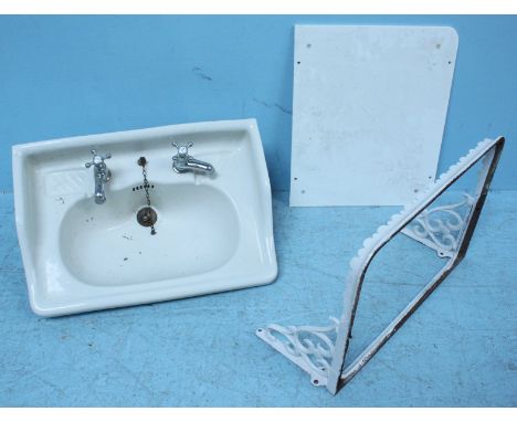 A 19th century white ceramic bathroom sink with original cast-iron wall-mounted bracket. (includes white marble panel for alt