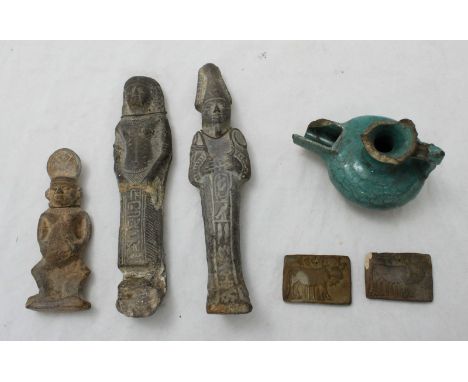 Two Egyptian carved stone Ushabti figures, 19cm high (one with old repairs), together with another small Egyptian Ushabti fig