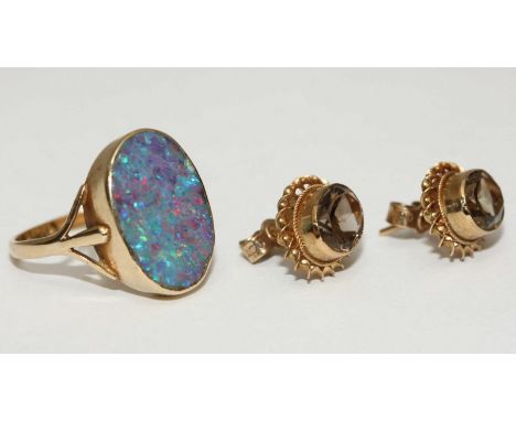 A 9ct gold opal doublet ring. Gross weight approximately 3.7g, together with a pair of 9ct gold earrings set with citrine col