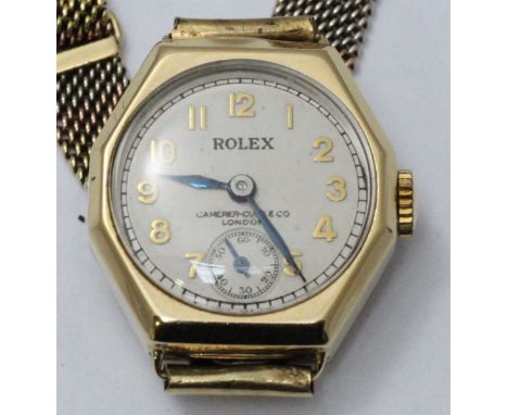 A 9 carat gold Rolex wristwatch on a three-colour gold flexible bracelet, Prima fifteen ruby movement, subsidiary seconds dia