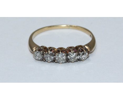 An 18ct gold and five stone diamond ring, total diamond weight approximately 0.5cts. Gross weight of ring approximately 2.8g.