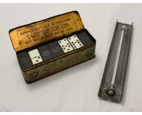 A set of EML & Co. British domino's in original tin, together with a metal, wall mounted barometer by Dring & Page, London.